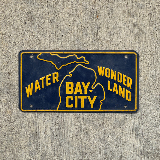Photo of a 1950 Era Bay City Michigan Booster License Plate Auto Tag Garage Decor Vintage Water Wonderland Metal with original patina