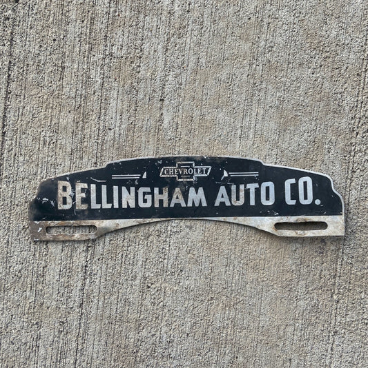 Photo of a 1950 Era Bellingham Wisconsin License Plate Topper Auto Tag Garage Decor Vintage Chevy Dealer Auto Co with original patina