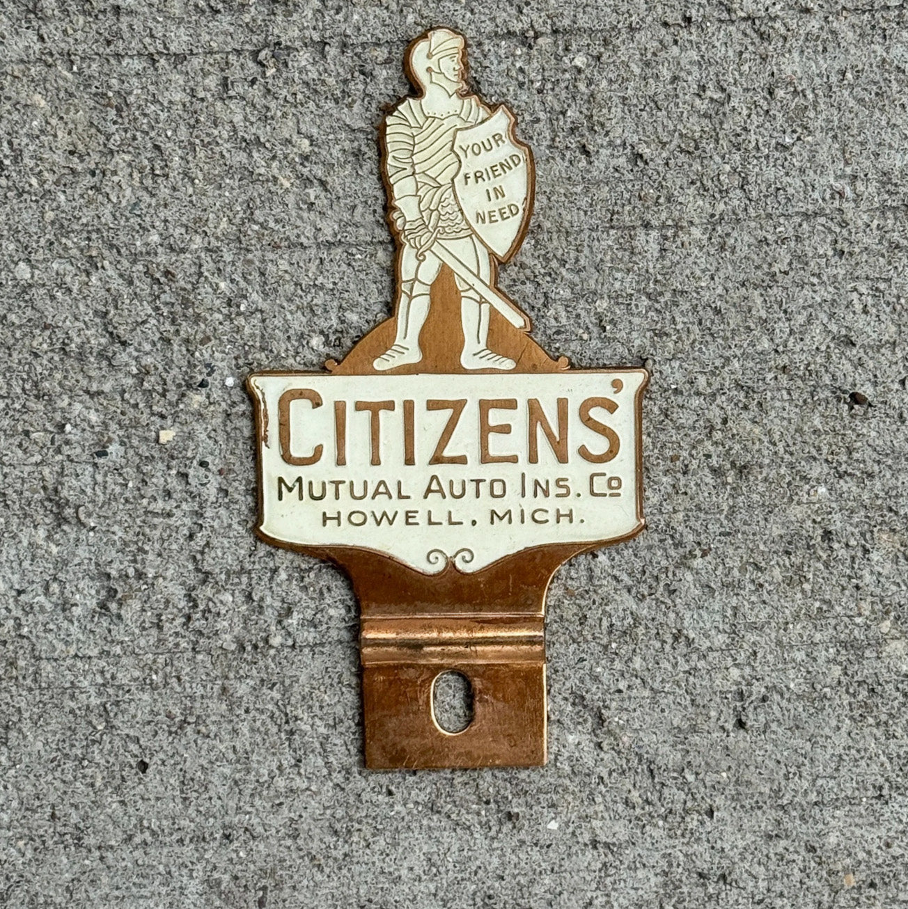 Photo of a 1950 Era Citizens' Howell Michigan License Plate Topper Auto Tag Garage Decor Vintage Auto Insurance Knight with original patina