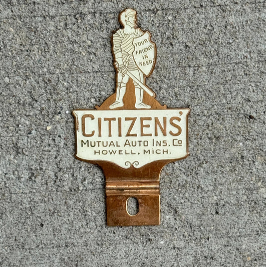 Photo of a 1950 Era Citizens' Howell Michigan License Plate Topper Auto Tag Garage Decor Vintage Auto Insurance Knight with original patina