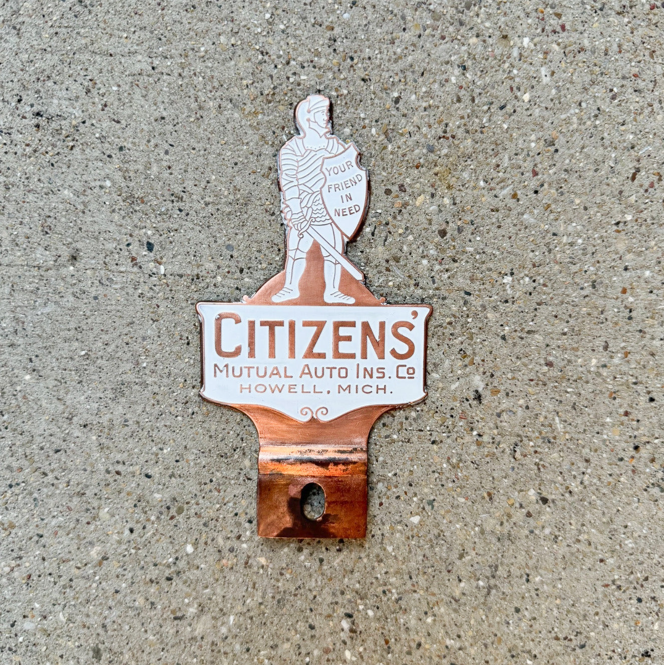 Photo of a 1950 Era Citizens' Howell Michigan License Plate Topper Auto Tag Garage Decor Vintage Auto Insurance Knight with original patina