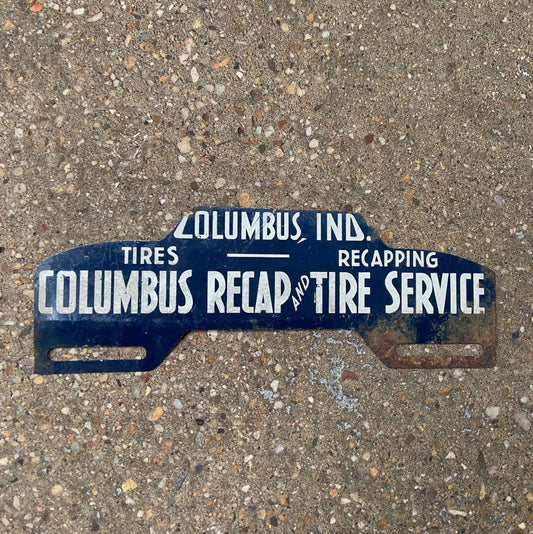 Photo of a 1950 Era Columbus Indiana License Plate Topper Auto Tag Garage Decor Vintage Recap and Tire Service Car Auto with original patina