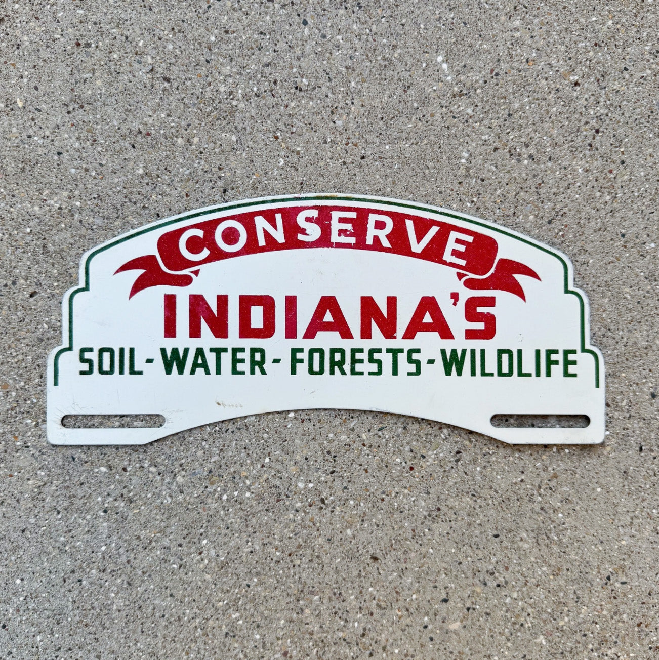 Photo of a 1950 Era Conserve Indiana License Plate Topper Auto Tag Garage Decor Vintage Conservation Wildlife Forest Soil with original patina
