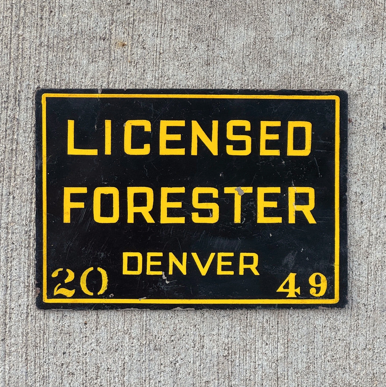 Photo of a 1950 Era Denver Colorado Licensed Forester License Plate Topper Auto Tag Garage Decor Vintage Sign 2049 with original patina