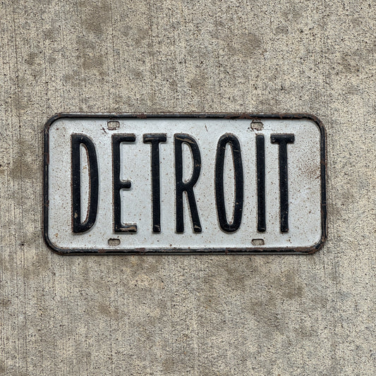 Photo of a 1950 Era Detroit Michigan Booster License Plate Auto Tag Garage Decor Vintage Metal with original patina