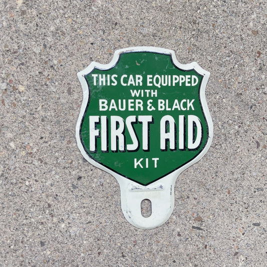 Photo of a 1950 Era First Aid License Plate Topper Auto Tag Garage Decor Vintage Bauer & Black Medical Advertising Emergency with original patina