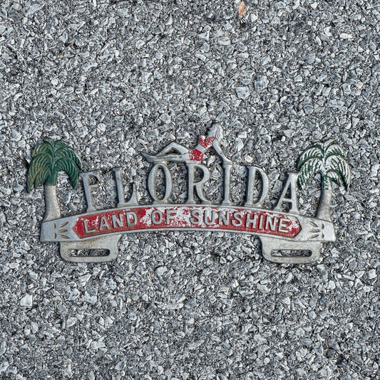 Photo of a 1950 Era Florida Florida License Plate Topper Auto Tag Cast Aluminum Nice Original with original patina