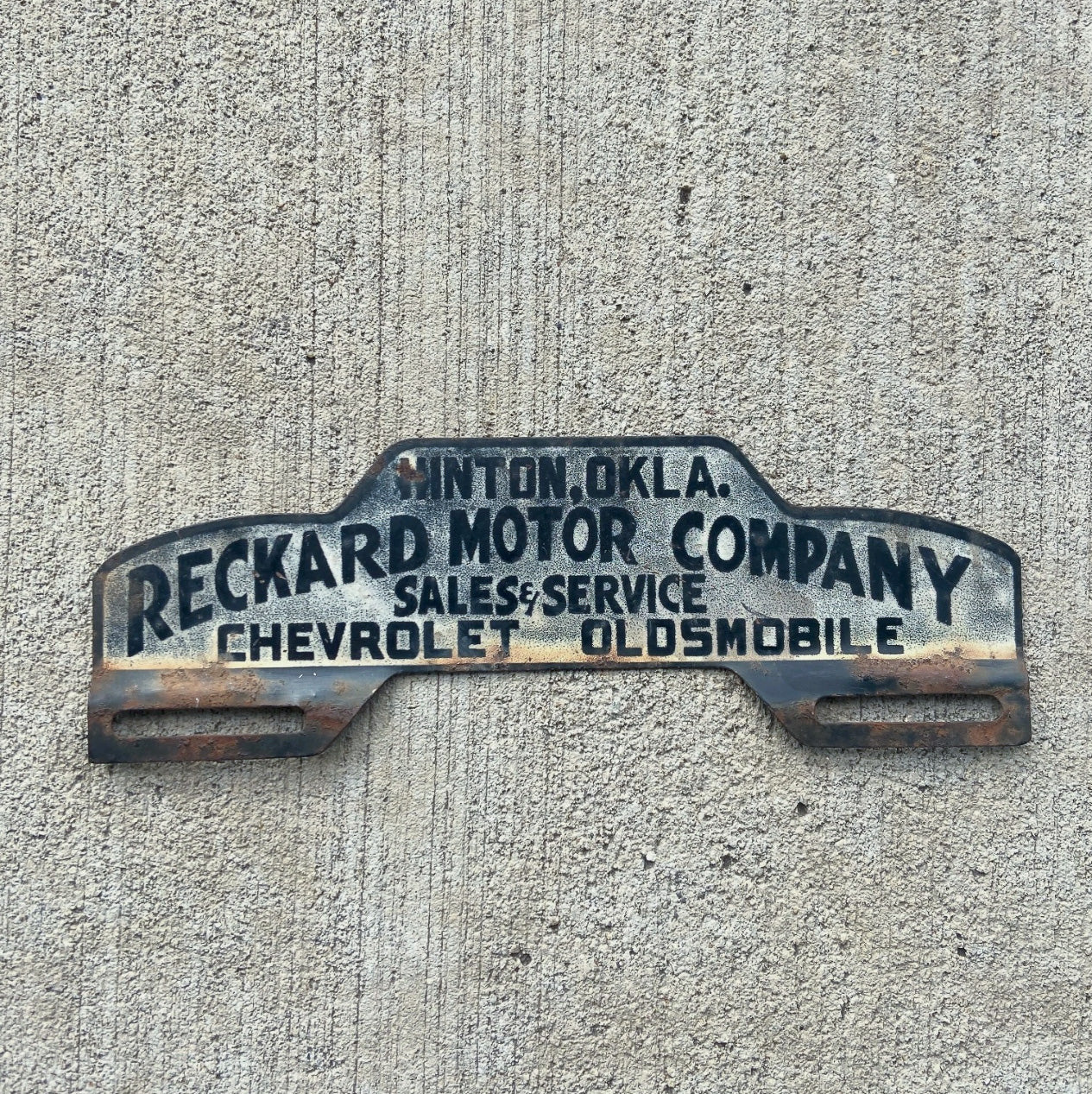 Photo of a 1950 Era Hinton Oklahoma License Plate Topper Auto Tag Garage Decor Vintage Chevy Oldsmobile Reckard Motor Co with original patina