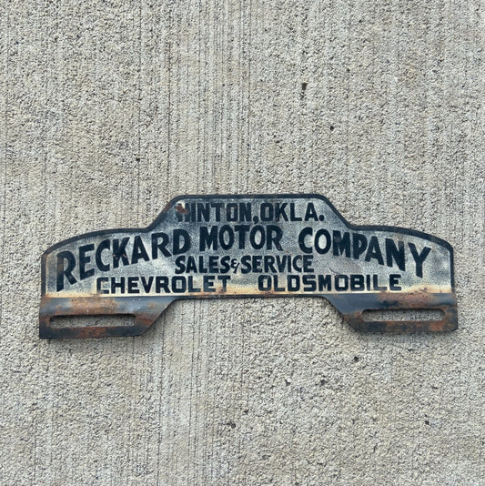 Photo of a 1950 Era Hinton Oklahoma License Plate Topper Auto Tag Garage Decor Vintage Chevy Oldsmobile Reckard Motor Co with original patina