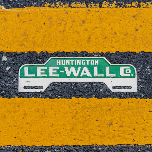 Photo of a 1950 Era Huntington Indiana License Plate Topper Auto Tag Garage Decor Vintage Lee Wall Co Car Dealer Dealership with original patina