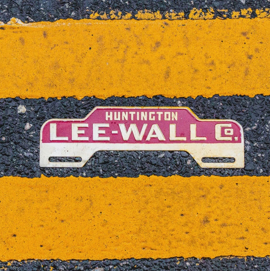 Photo of a 1950 Era Huntington Indiana License Plate Topper Auto Tag Garage Decor Vintage Lee Wall Co Car Dealer Dealership with original patina