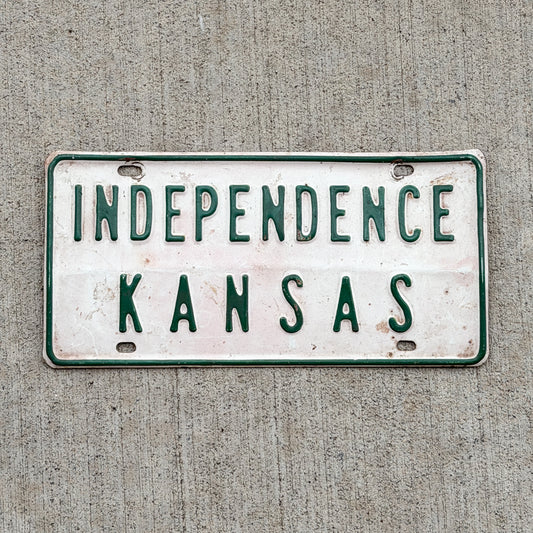 Photo of a 1950 Era Independence Kansas Booster License Plate Auto Tag Garage Decor Vintage with original patina