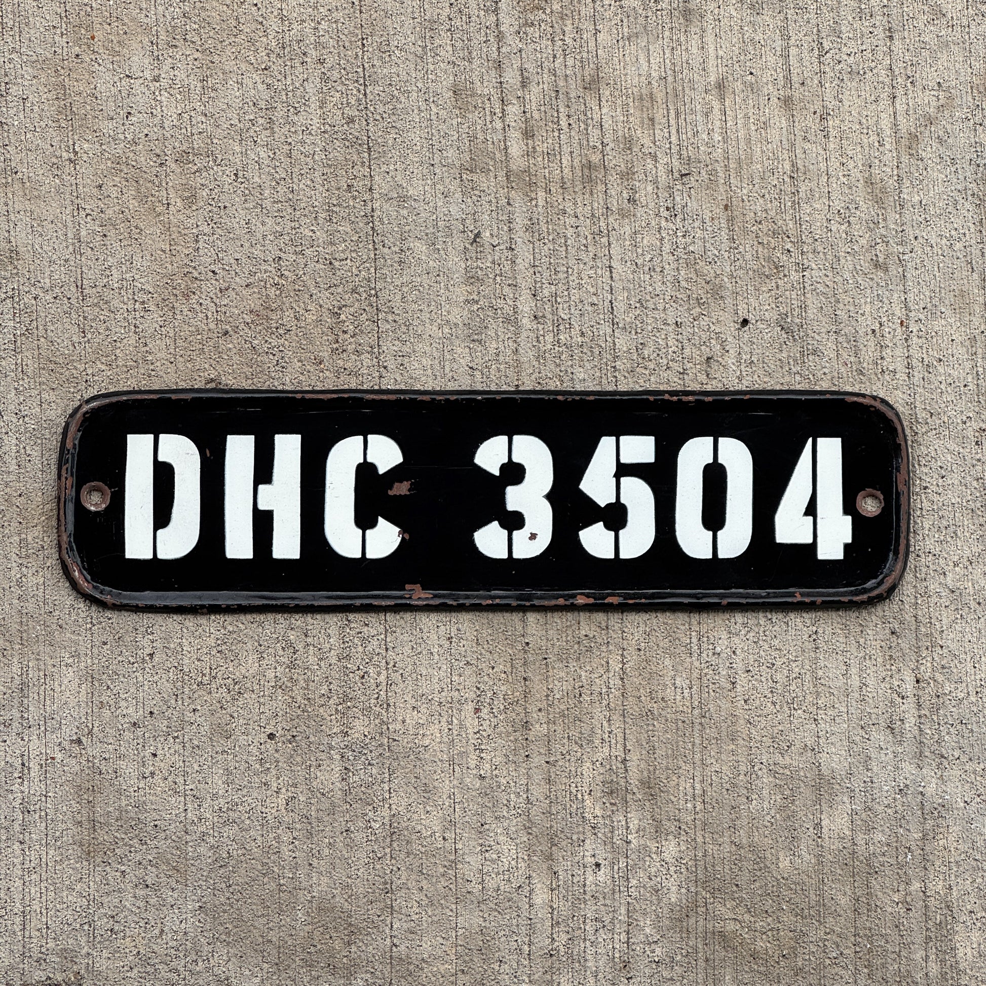 Photo of a 1950 Era India License Plate Auto Tag Garage Decor Vintage National Capital Territory Delhi DHC 3504 with original patina
