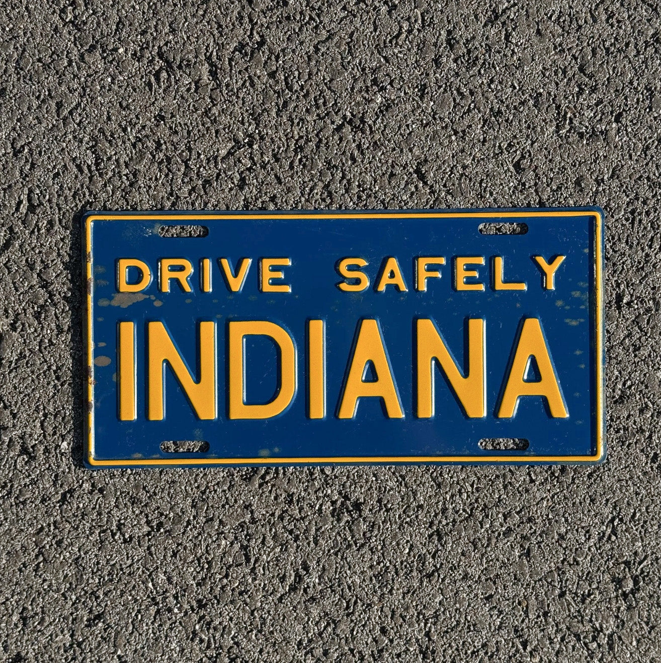 Photo of a 1950 Era Indiana Booster License Plate Auto Tag Garage Decor Vintage Drive Safely with original patina