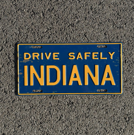 Photo of a 1950 Era Indiana Booster License Plate Auto Tag Garage Decor Vintage Drive Safely with original patina