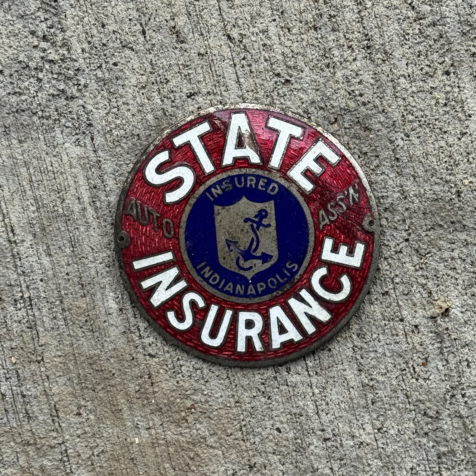 Photo of a 1950 Era Indianapolis State Insurance Indiana Porcelain Badge Emblem License Plate Topper Auto Tag Garage Decor Vintage with original patina