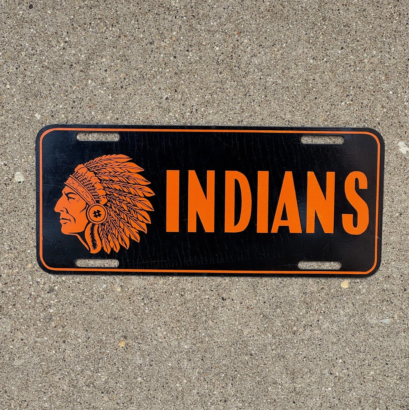 Photo of a 1950 Era Indians Booster License Plate Auto Tag Garage Decor Vintage Native American Graphic Indians with original patina