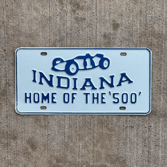 Photo of a 1950 Era Indy 500 Indiana Booster License Plate Auto Tag Garage Decor Vintage Indianapolis Race Car Graphic with original patina