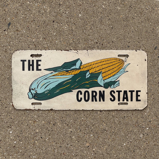 Photo of a 1950 Era Iowa Booster License Plate Auto Tag Garage Decor Vintage Corn State Cob Ear Thanksgiving Kitchen with original patina