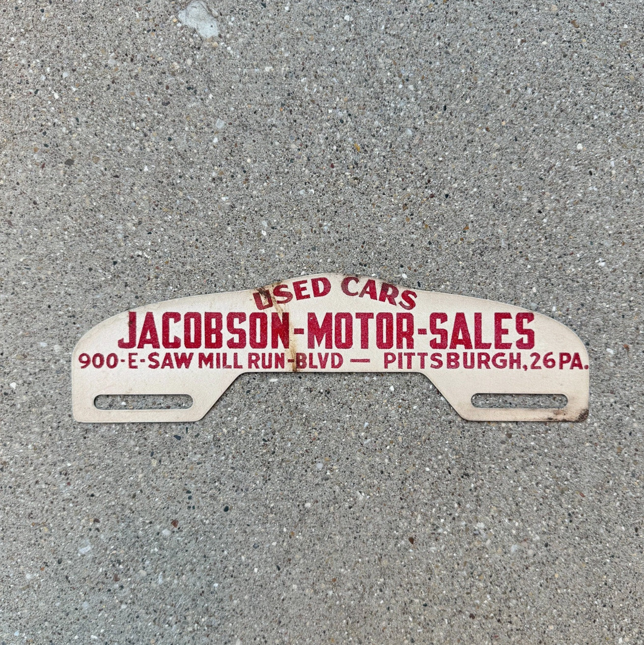 Photo of a 1950 Era Jacobson Pittsburgh Pennsylvania License Plate Topper Auto Tag Garage Decor Vintage Used Car Dealer with original patina