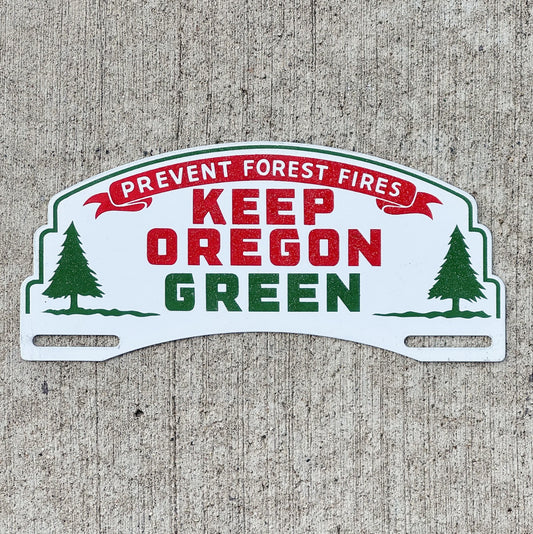 Photo of a 1950 Era Keep Oregon License Plate Topper Auto Tag Garage Decor Vintage Forest Fire Conservation with original patina