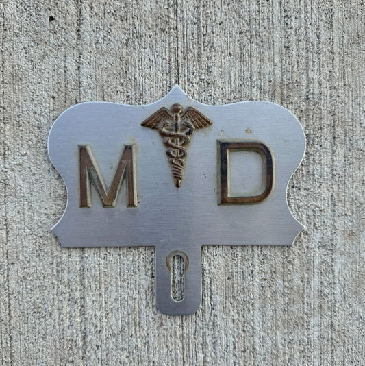 Photo of a 1950 Era Medical Doctor License Plate Topper Auto Tag Garage Decor Vintage Vintage Wall Decor Nurse Caduceus with original patina