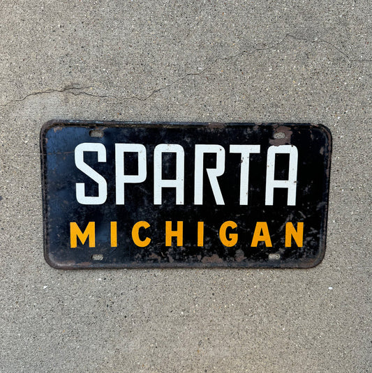 Photo of a 1950 Era Michigan Booster License Plate Auto Tag Garage Decor Vintage SPARTA with original patina