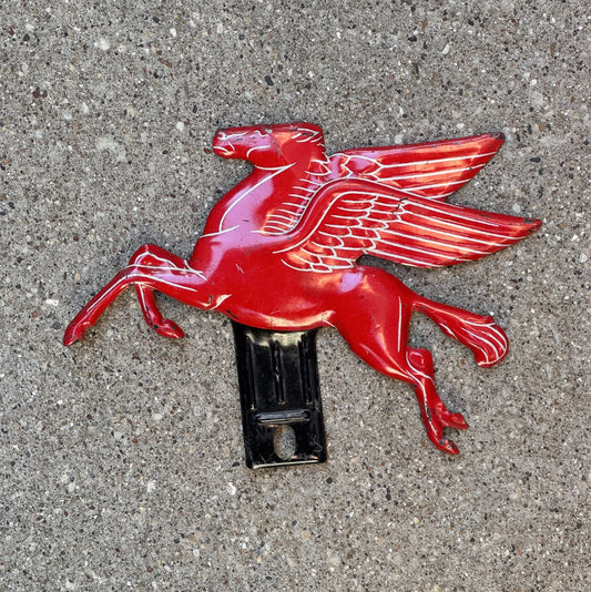 Photo of a 1950 Era Mobil Pegasus License Plate Topper Auto Peggy Gas and Oil Collectible Garage with original patina