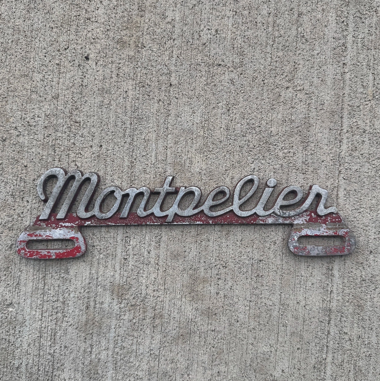 Photo of a 1950 Era Montpelier Vermont License Plate Topper Auto Tag Garage Decor Vintage Cast Aluminum Vintage Original with original patina