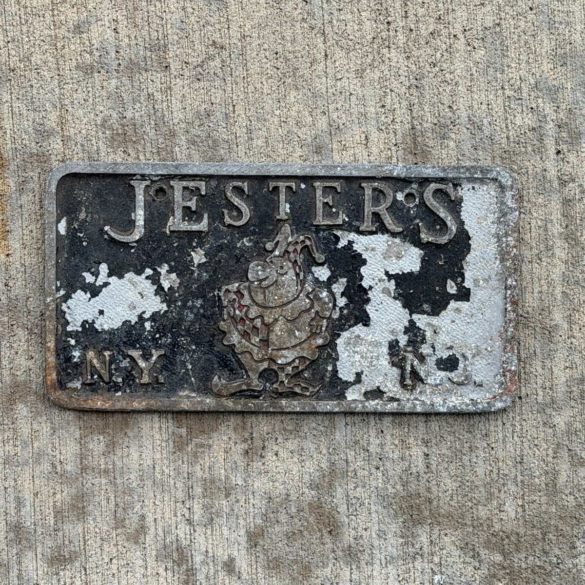 Photo of a 1950 Era New York Booster License Plate Auto Tag Garage Decor Vintage Cast Aluminum Plaque Chicago Metal Craft Inc California Road Jesters Car Club Clown Joker with original patina
