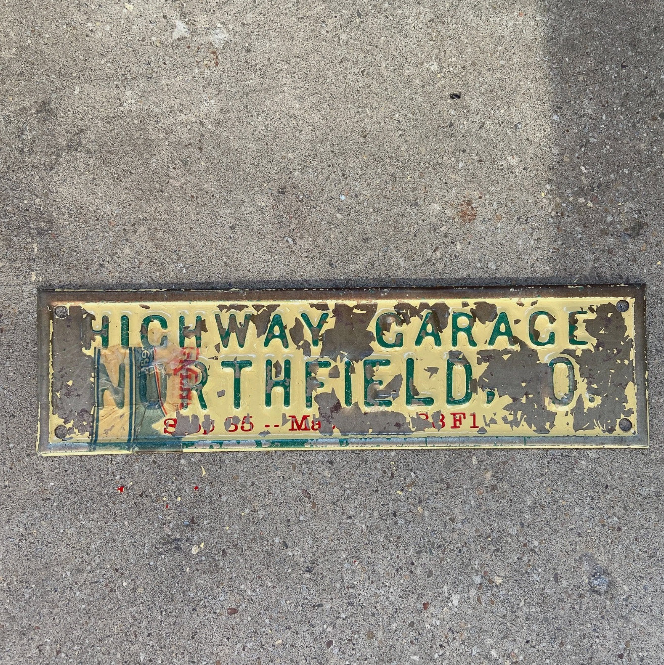 Photo of a 1950 Era Northfield Ohio License Plate Topper Auto Tag Garage Decor Vintage Highway Garage Car Dealer Auto with original patina