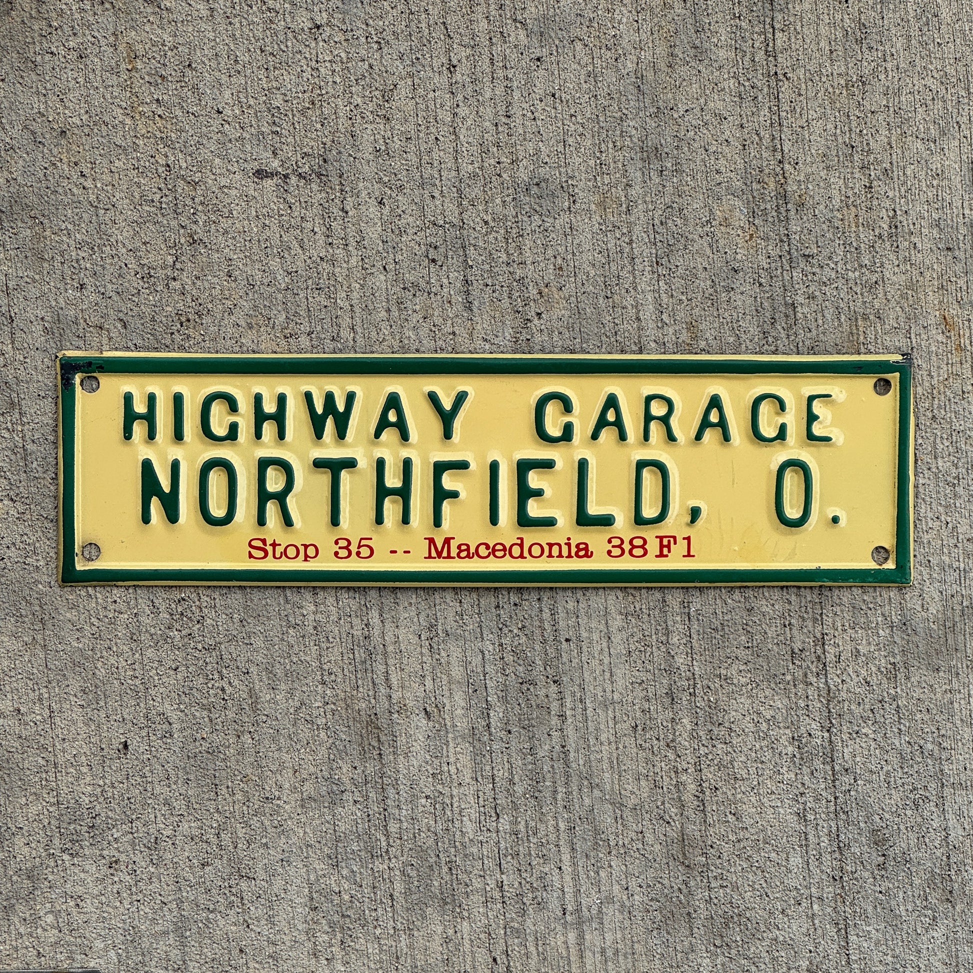 Photo of a 1950 Era Northfield Ohio License Plate Topper Auto Tag Garage Decor Vintage Highway Garage Macedonia with original patina