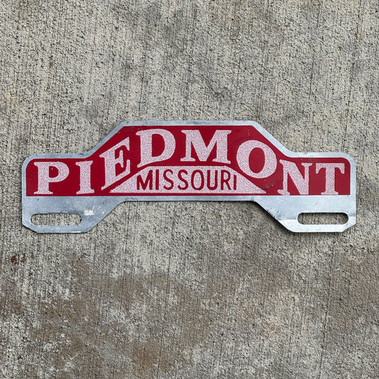 Photo of a 1950 Era Piedmont Missouri License Plate Topper Auto Tag Garage Decor Vintage Smaltz Reflective Paint with original patina