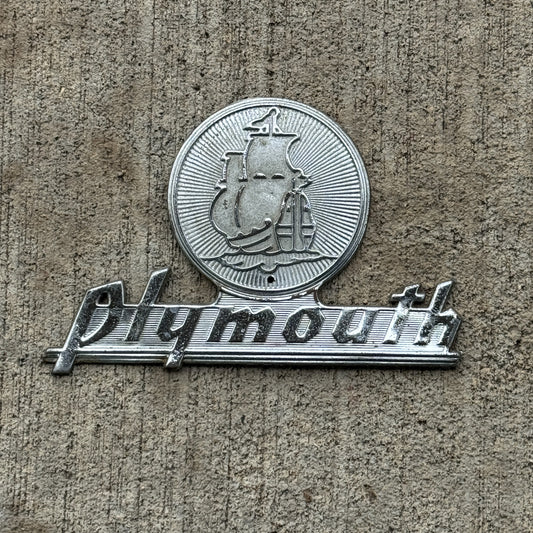 Photo of a 1950 Era Plymouth Badge Emblem Auto Tag Garage Decor Vintage with original patina