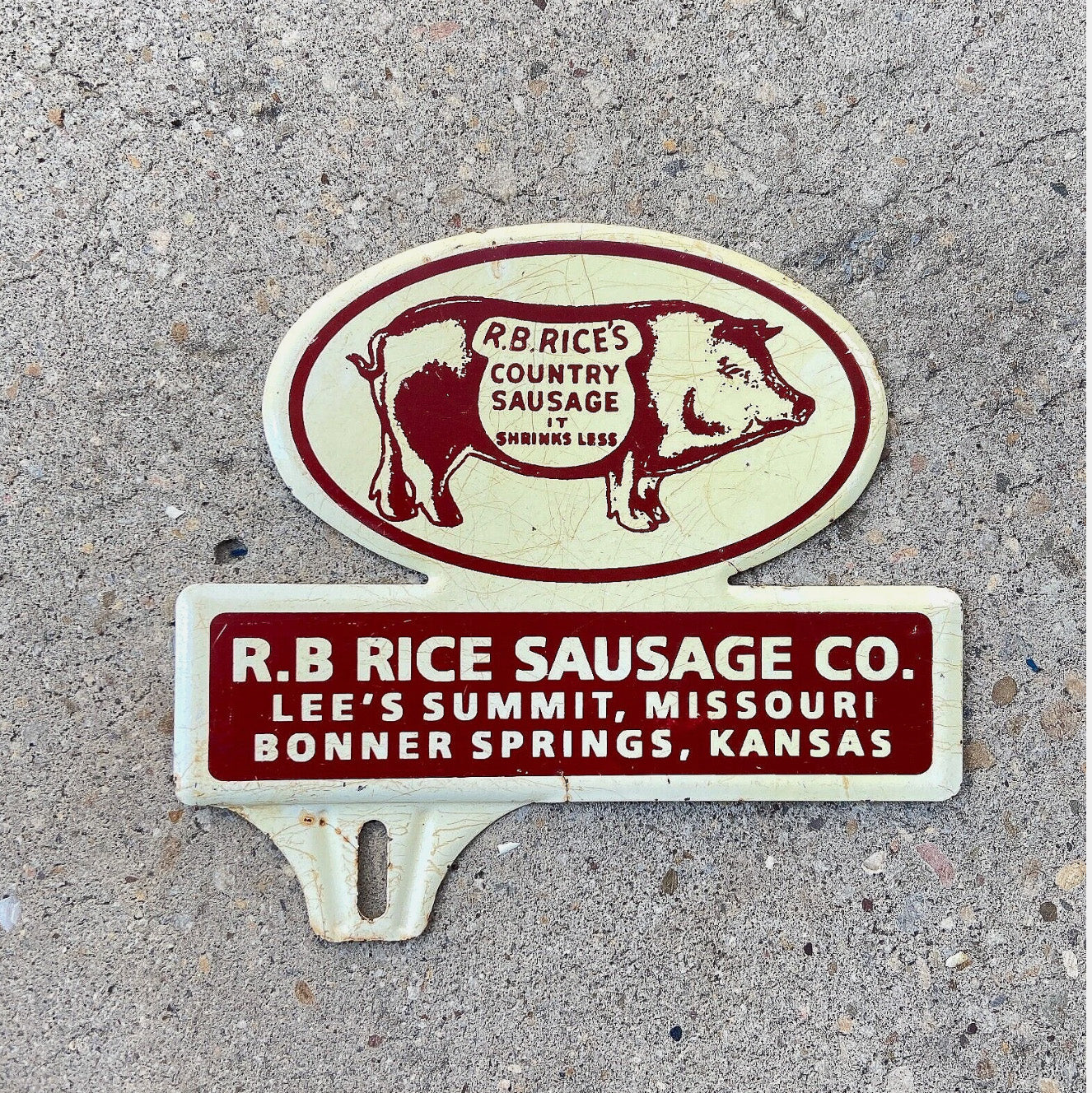 Photo of a 1950 Era R B Rice Sausage Co. Kansas License Plate Topper Auto Tag Garage Decor Vintage Pig Graphic Sausage Advertising Missouri with original patina