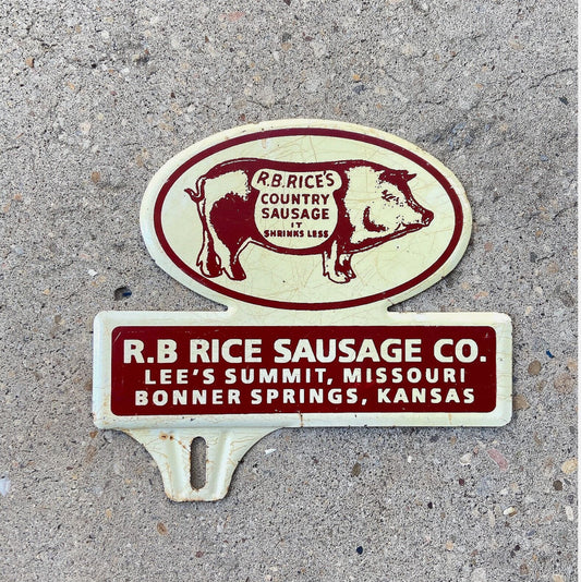 Photo of a 1950 Era R B Rice Sausage Co. Kansas License Plate Topper Auto Tag Garage Decor Vintage Pig Graphic Sausage Advertising Missouri with original patina