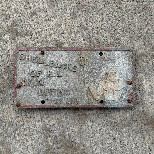 Photo of a 1950 Era Rhode Island Booster License Plate Auto Tag Garage Decor Vintage Cast Aluminum Plaque Chicago Metal Craft Inc Shellbacks of RI Skin Diving Club Poseidon with original patina