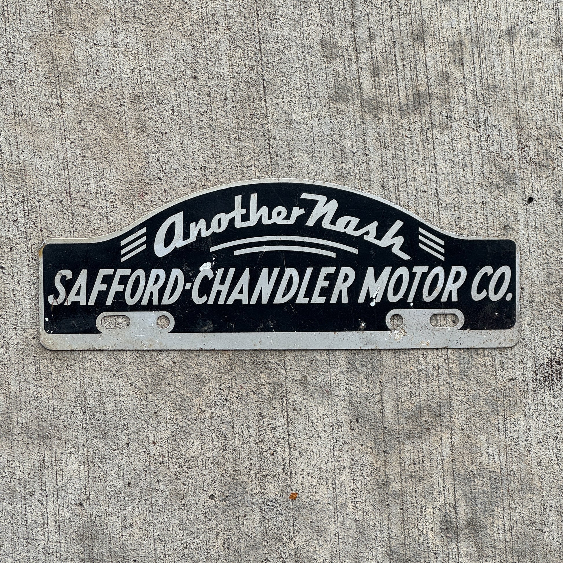 Photo of a 1950 Era Safford Chandler Motor Co Washington DC License Plate Topper Auto Tag Garage Decor Vintage Nash Dealer with original patina