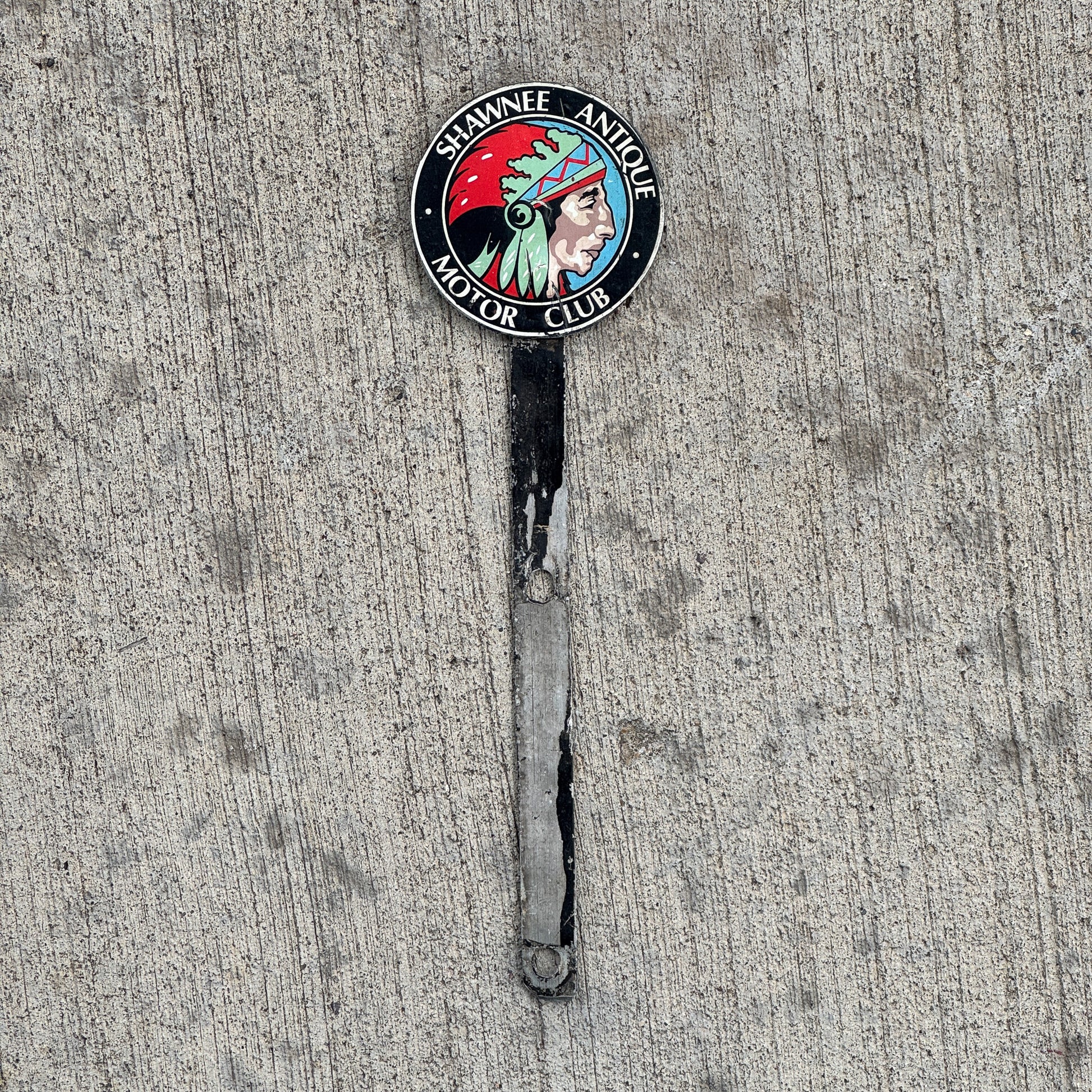Photo of a 1950 Era Shawnee Antique Motor Club License Plate Topper Auto Tag Garage Decor Vintage Native American Indian Graphic with original patina