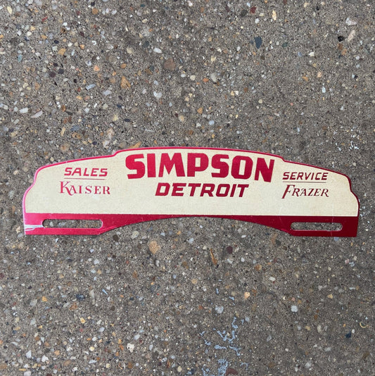 Photo of a 1950 Era Simpson Detroit Michigan License Plate Topper Auto Tag Garage Decor Vintage Car Dealer Kaiser Frazer with original patina