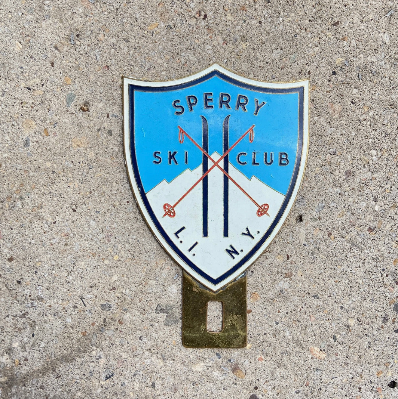 Photo of a 1950 Era Sperry Ski Club New York License Plate Topper Auto Tag Garage Decor Vintage Long Island NY Skiing Decor with original patina