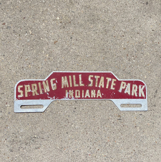 Photo of a 1950 Era Spring Mill State Park Indiana License Plate Topper Auto Tag Garage Decor Vintage Reflective Smaltz Paint with original patina