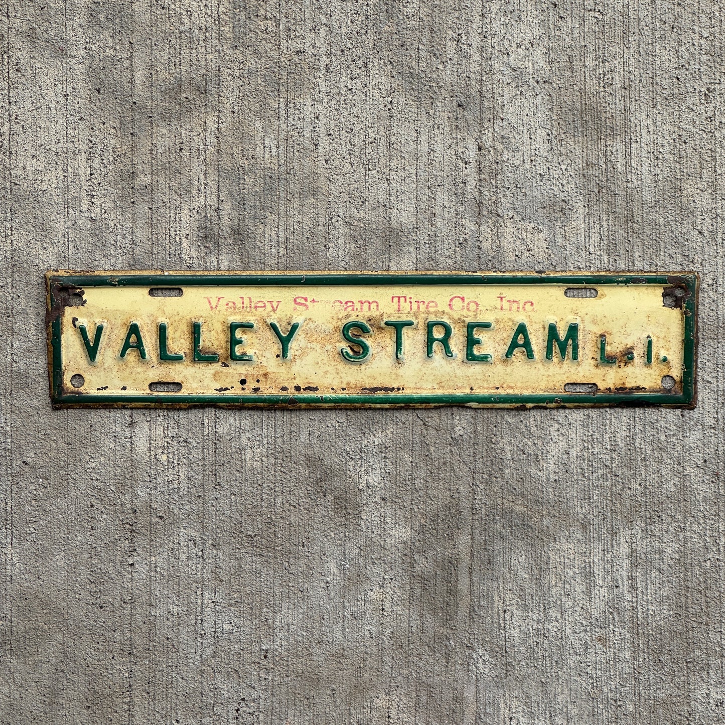 Photo of a 1950 Era Valley Stream Long Island New York License Plate Topper Auto Tag Garage Decor Vintage Valley Stream Tire Co Inc with original patina