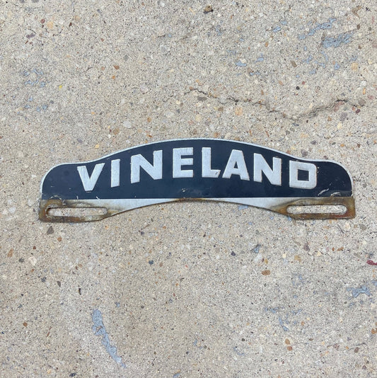 Photo of a 1950 Era Vineland New Jersey License Plate Topper Auto Tag Garage Decor Vintage NJ Black Silver Millville with original patina