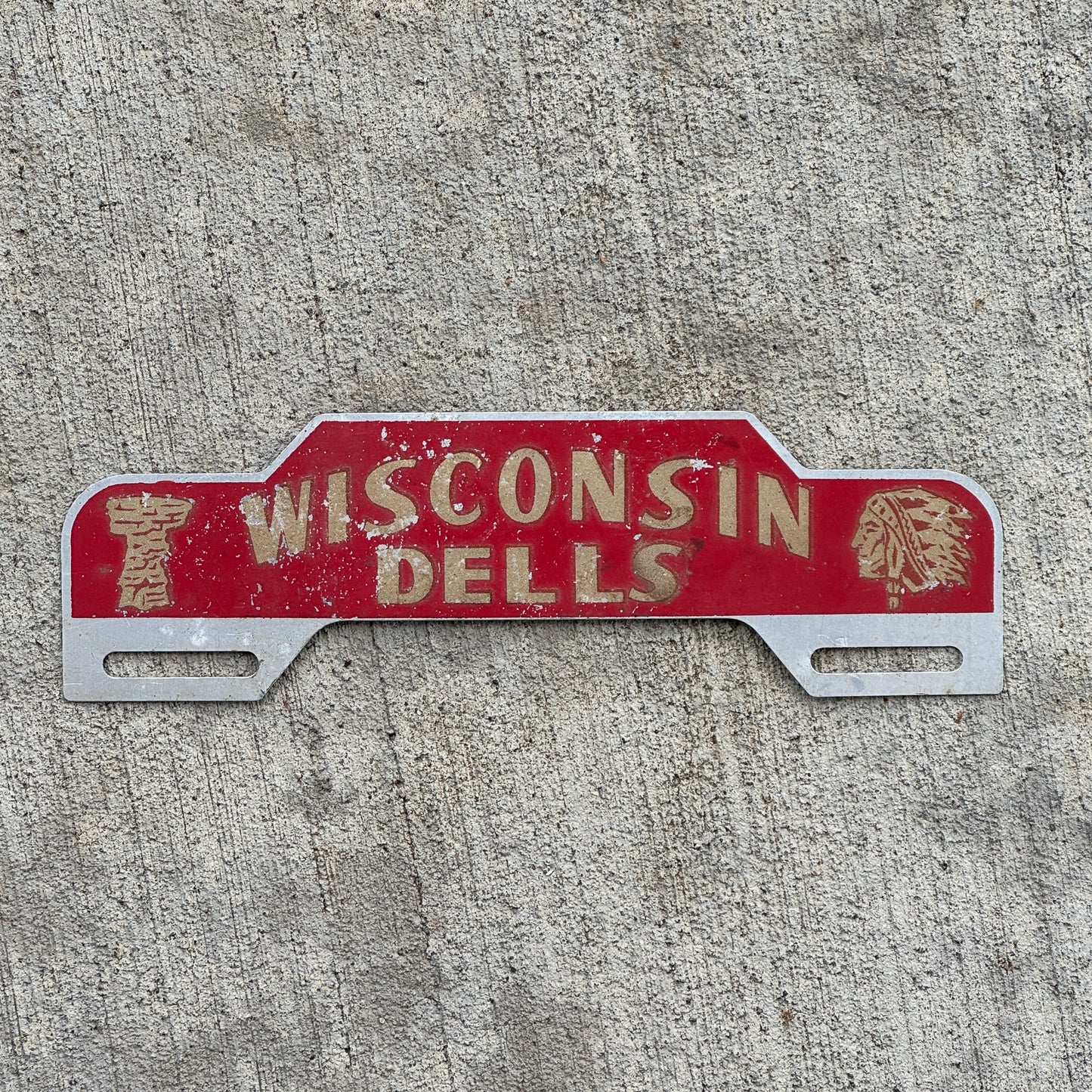 Photo of a 1950 Era Wisconsin Dells Wisconsin License Plate Topper Auto Tag Garage Decor Vintage Smaltz Reflective Paint with original patina