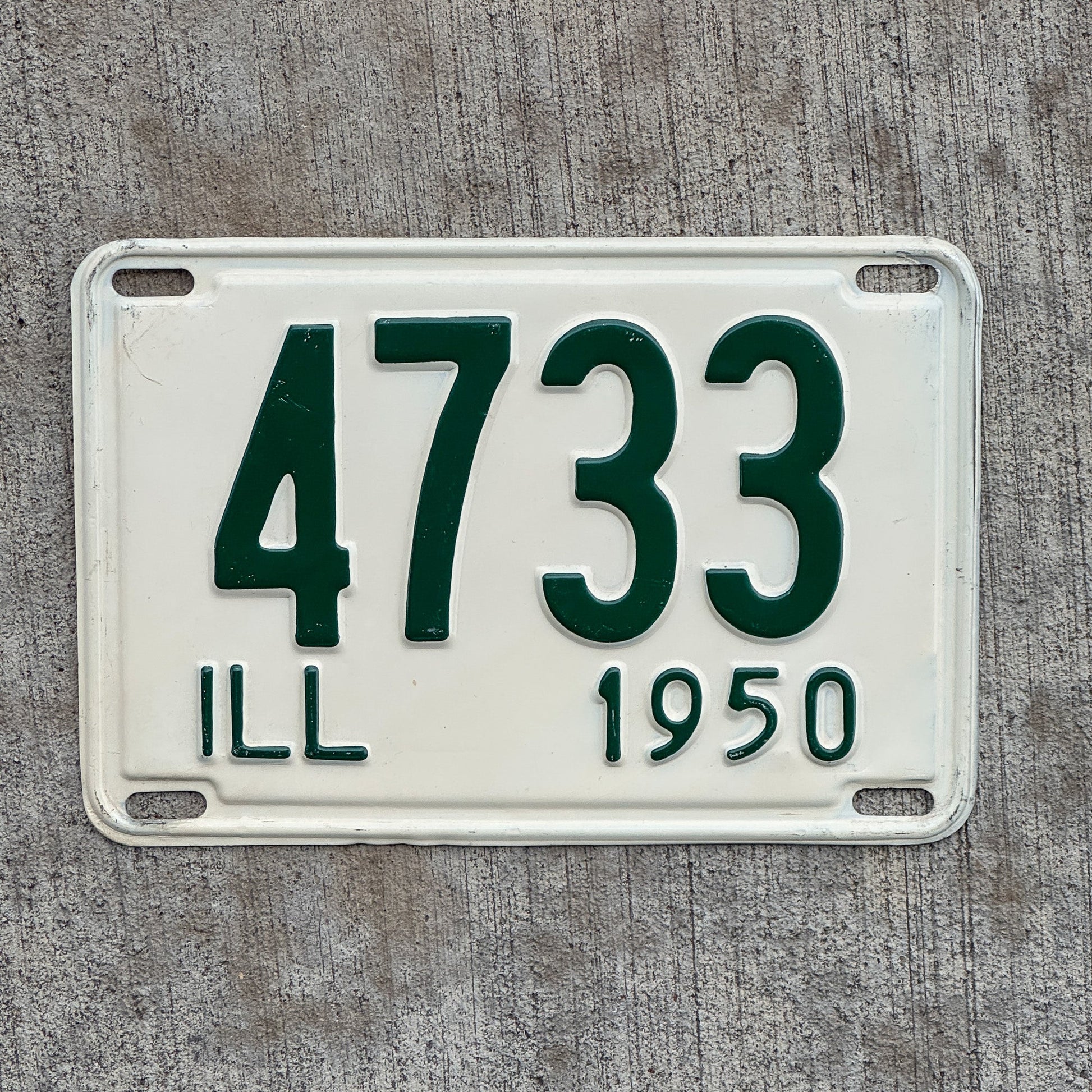 Photo of a 1950 Illinois License Plate Auto Tag Garage Decor Vintage Low Number Four Digit 4733 with original patina