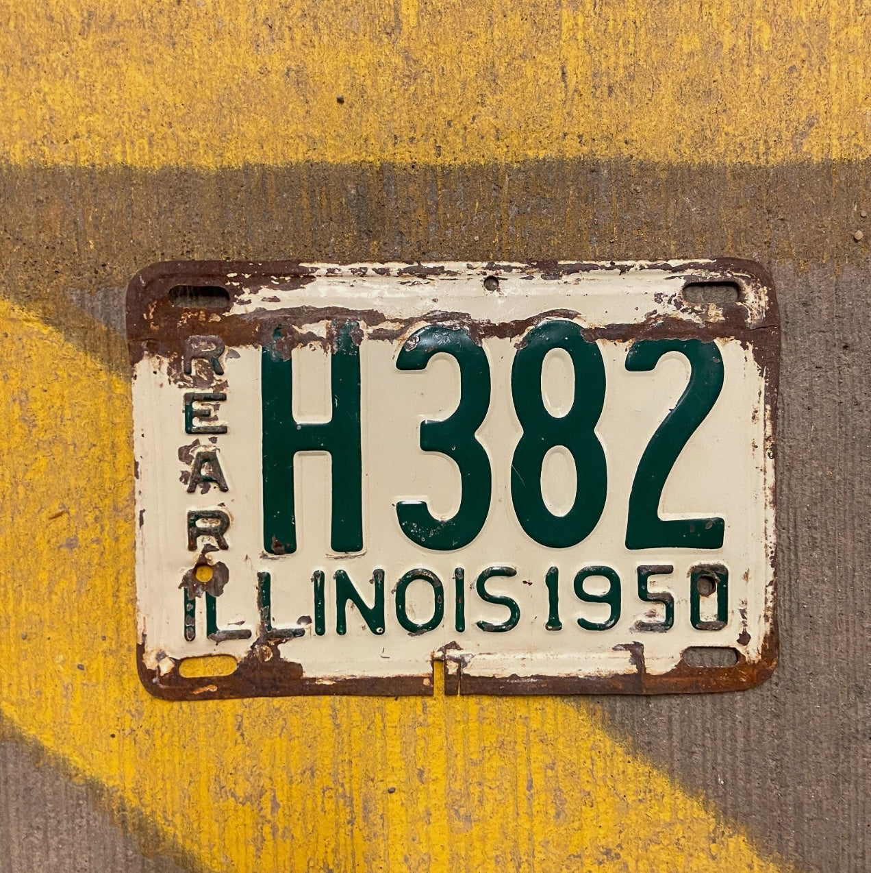 Photo of a 1950 Illinois Truck License Plate Auto Tag Garage Decor Vintage Low Number Three Digit H 382 with original patina