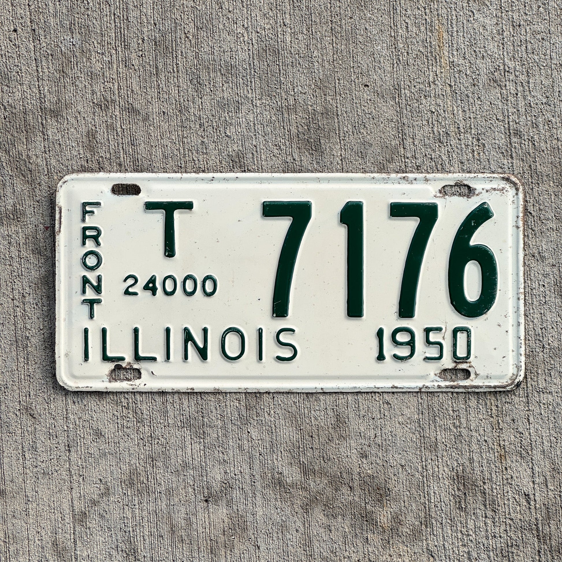 Photo of a 1950 Illinois Truck Mileage Tax Front License Plate Auto Tag 1 Vintage Garage 24000 LBS T 7176 with original patina