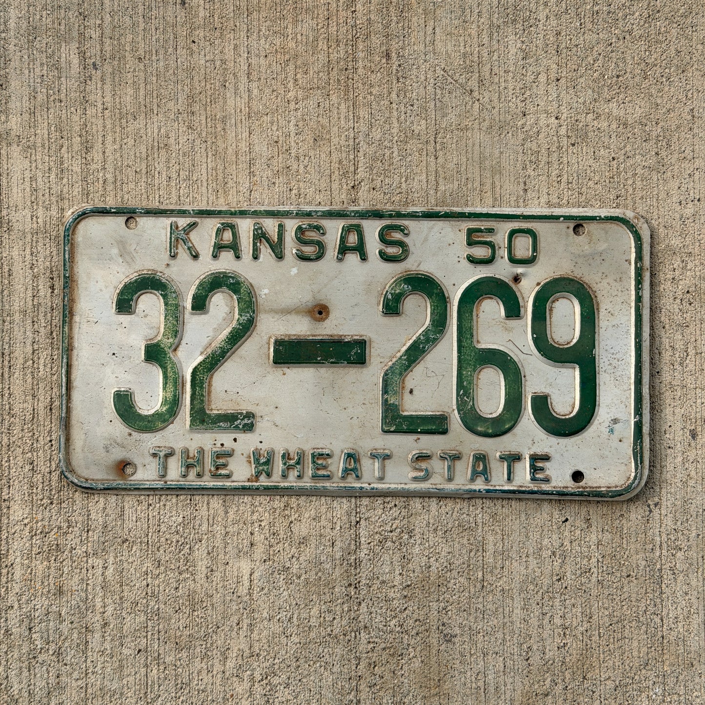 Photo of a 1950 Kansas License Plate Auto Tag Garage Decor Vintage 32 269 with original patina
