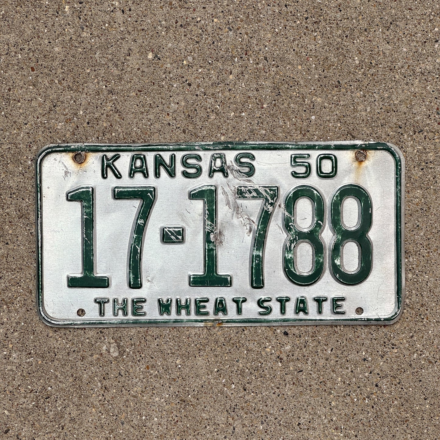 Photo of a 1950 Kansas License Plate Auto Tag Garage Decor Vintage Wheat State 17 1788